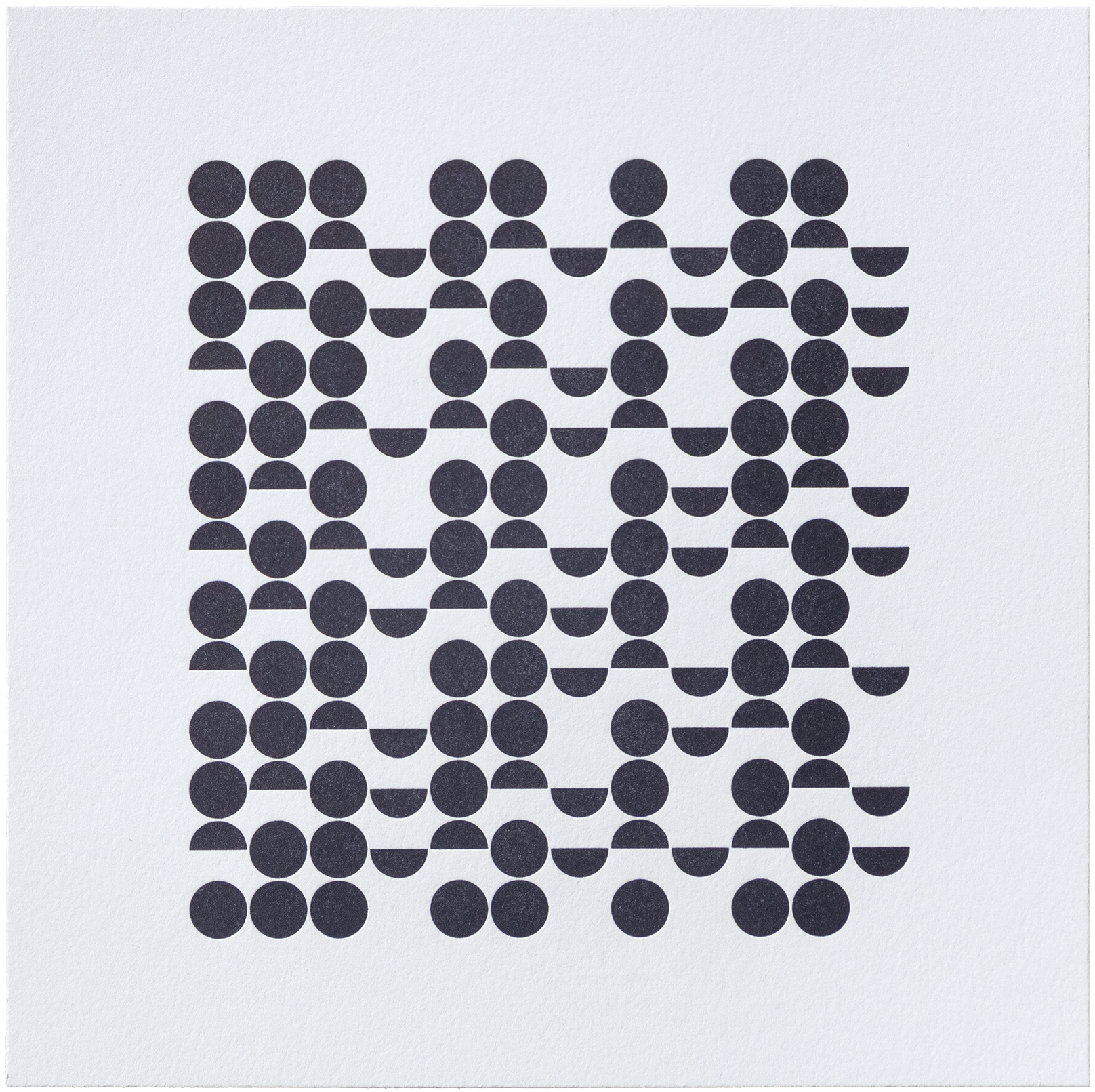 A geometric grid of black circles and semicircles